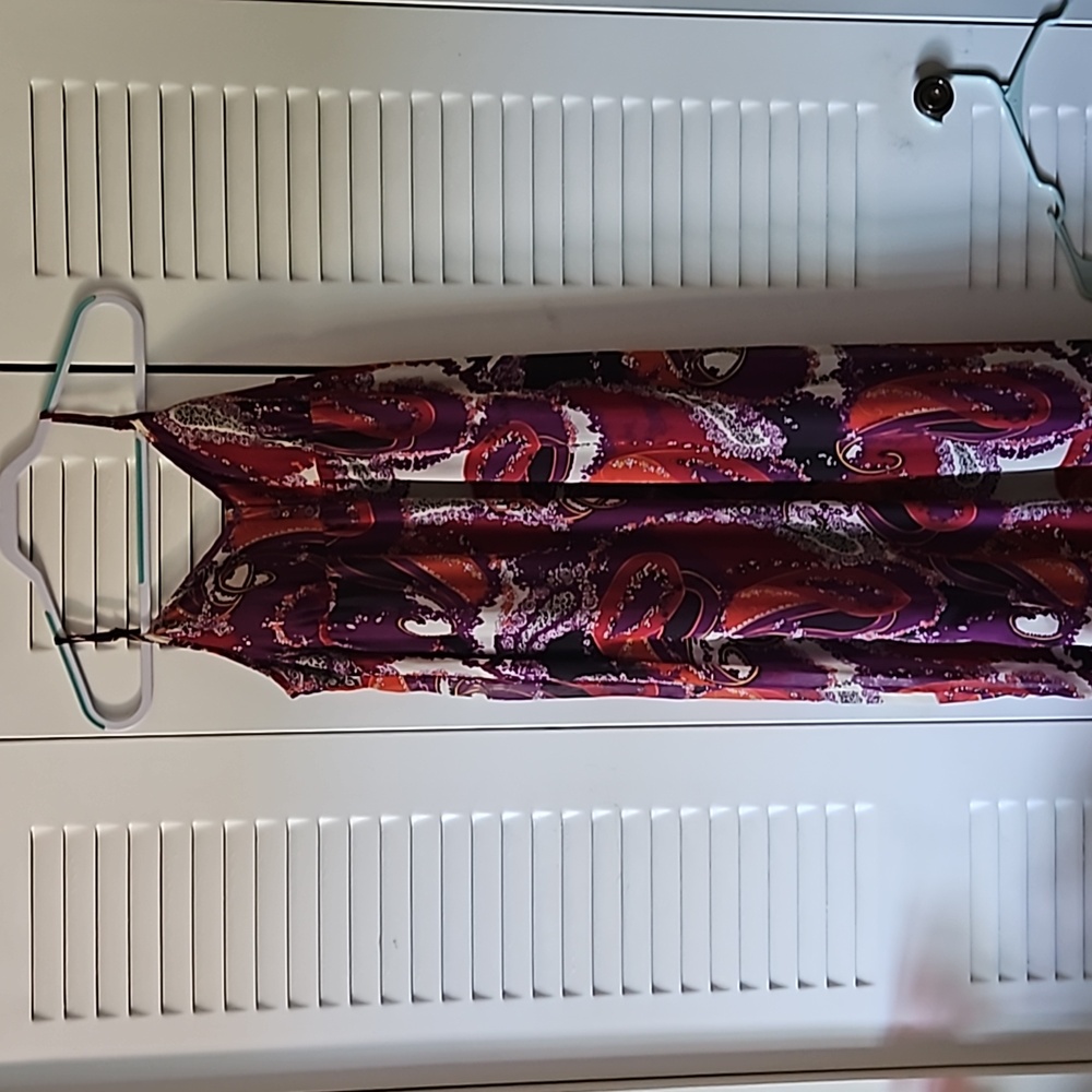 Full length dress with spaghetti straps. The overlay is sheer but lined.